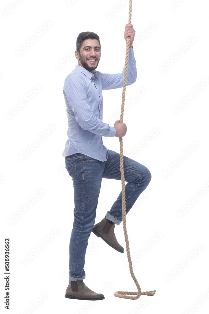 Fototapeta premium ambitious young man climbing a rope. isolated on a white background.
