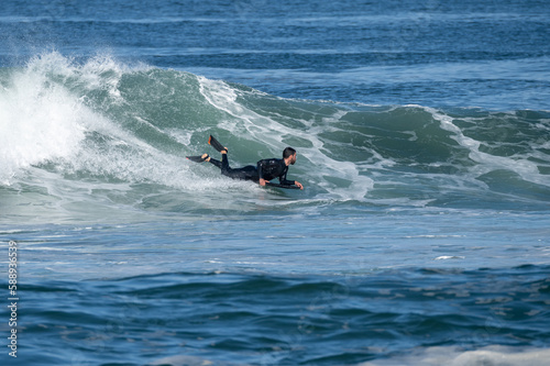 Bodyboarder surfing ocean wave © homydesign