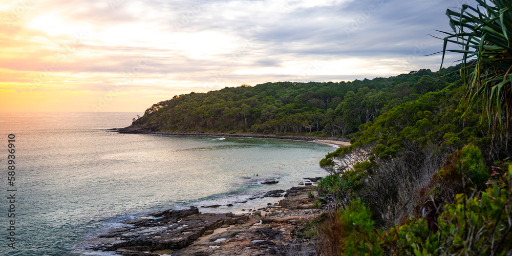 A beautiful cameral hidden little cove bay covered with greenery in Noosa National Park, Queensland, Australia