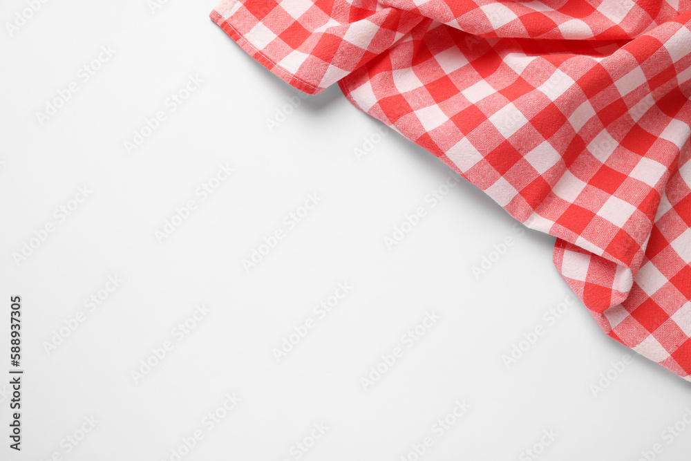 Obraz premium Red checkered tablecloth on white background, top view