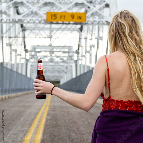 woman beer texas bridge