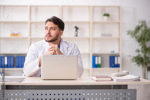 Young male doctor in telemedicine concept