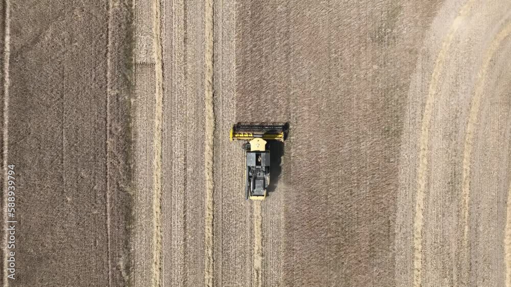 Aerial view of cereal harvesters and tractors at a farm in Oderbruch, Brandenburg, Germany. Aerial view of cereal harvesters and tractors at a farm in Oderbruch, Brandenburg, Germany.