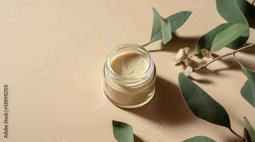 Jar of organic cream with eucalyptus leaves on beige background. Cosmetic product mock up.