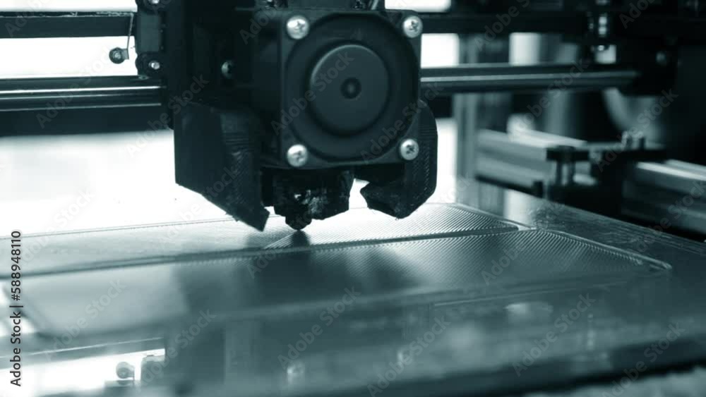 3D printer. 3d printer printing close-up. Molten plastic flowing out of extruder and forming prototype model. New modern additive technologies for printing 3D printer. Electronic device for modeling. 3D printer. 3d printer printing close-up. Molten plastic flowing out of extruder and forming prototype model. New modern additive technologies for printing 3D printer. Electronic device for modeling.