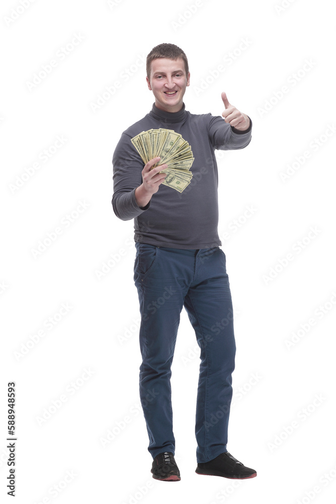 in full growth. casual young man with dollar bills.