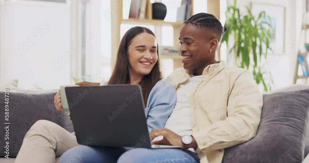 Laptop, coffee and couple talking in living room on home sofa, relax or online shopping. Computer, interracial and happiness of man and woman on couch internet browsing, social media or web scrolling Laptop, coffee and couple talking in living room on home sofa, relax or online shopping. Computer, interracial and happiness of man and woman on couch internet browsing, social media or web scrolling