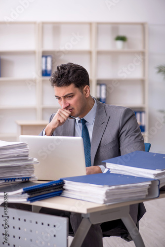 Young male employee working in the office