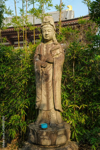 Tokyo, Japan - March 9, 2023: Statue of Kannon at Zojoji Temple is a Buddhist temple in Minato, Tokyo, Japan. photo