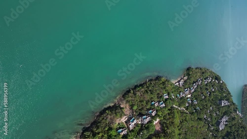 Vertical aerial view over beautiful luxury resort next to ocean photo