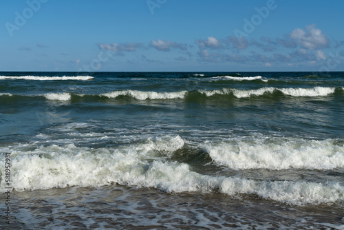 Fototapeta Naklejka Na Ścianę i Meble -  View of the incoming wave on the Baltic Sea on the shore of the Curonian Spit on a summer day, Kaliningrad region, Russia