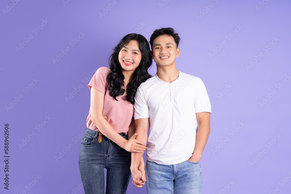 image of asian couple posing on purple background image of asian couple posing on purple background