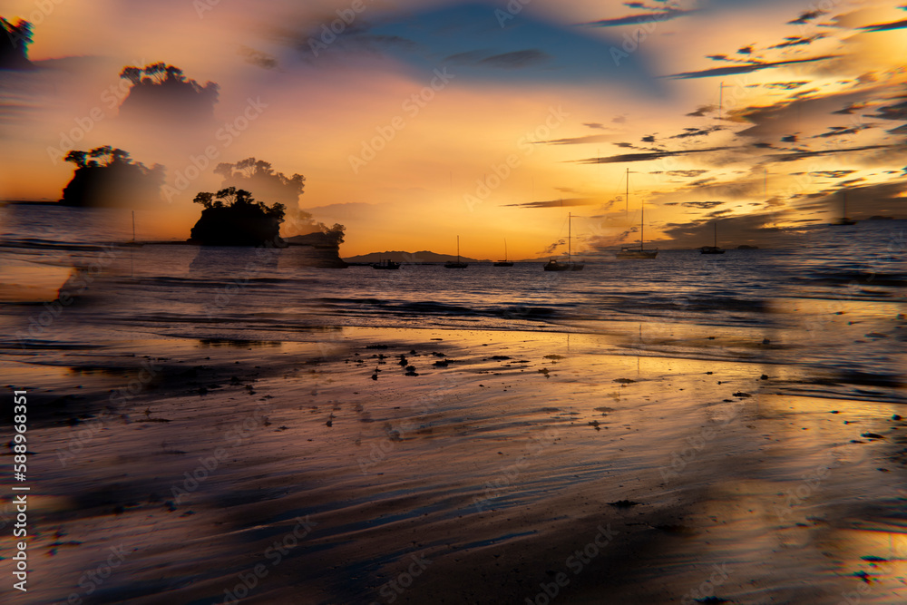 A sunrise at the beach showing an island and shot using a prism filter A sunrise at the beach showing an island and shot using a prism filter
