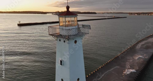 Early winter morning aerial video of Sodus Point Lighthouse, Sodus, New York. photo