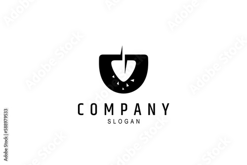 shovel logo in silhouette style with stone or pebble decoration