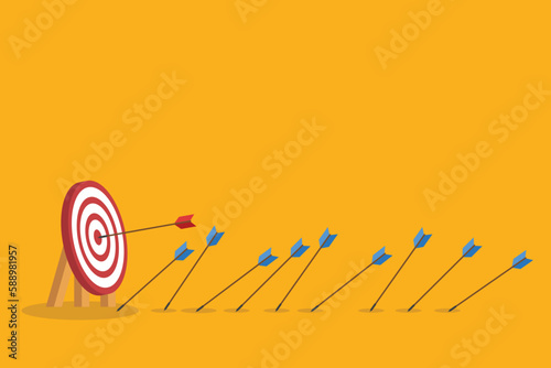 Business challenge failure and success concept. Blue arrows missed hitting target and only red one hits the center.	