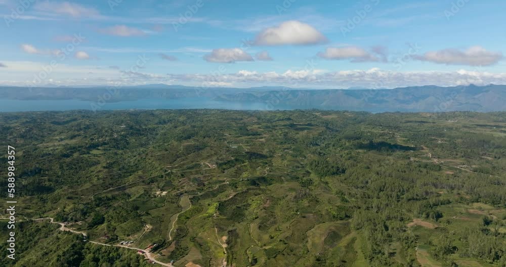 Aerial view of Samosir Island and Lake Toba in Sumatra. Tropical landscape. Indonesia. Aerial view of Samosir Island and Lake Toba in Sumatra. Tropical landscape. Indonesia.