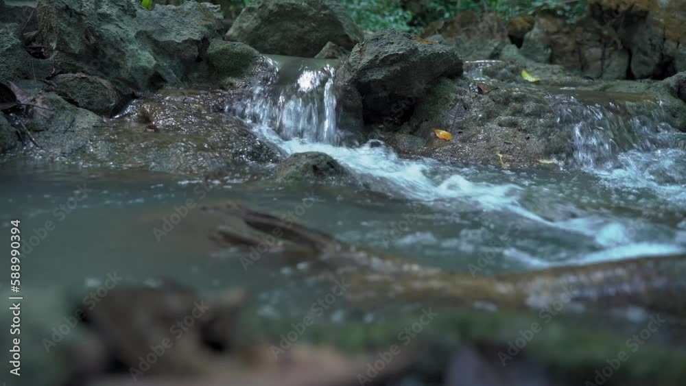 A small waterfall in Phang Nga, Thailand, a bright and refreshing waterfall suitable for vacations. Little known secret waterfall A small waterfall in Phang Nga, Thailand, a bright and refreshing waterfall suitable for vacations. Little known secret waterfall