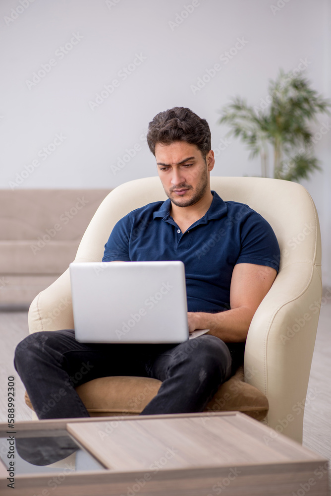 Young male freelancer working from home Young male freelancer working from home
