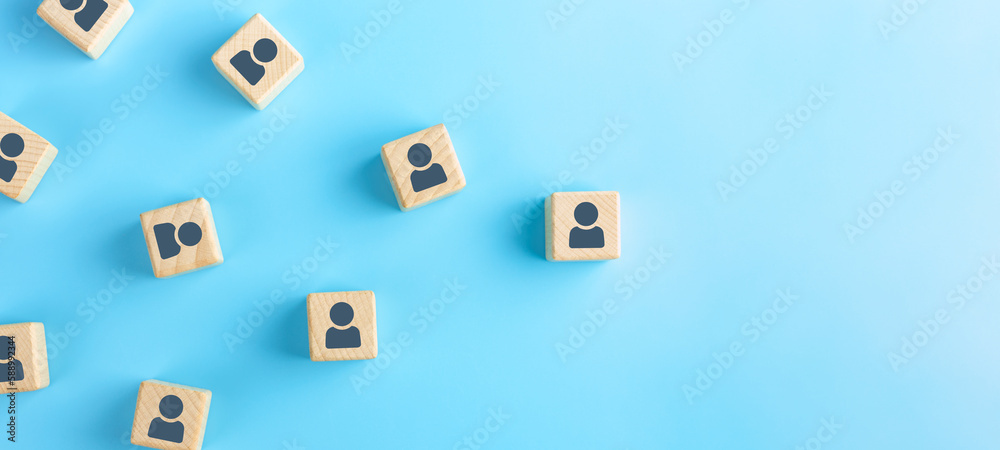 Wooden cubes with person icon on blue background, Organisation structure, social network and community concepts. Wooden cubes with person icon on blue background, Organisation structure, social network and community concepts.