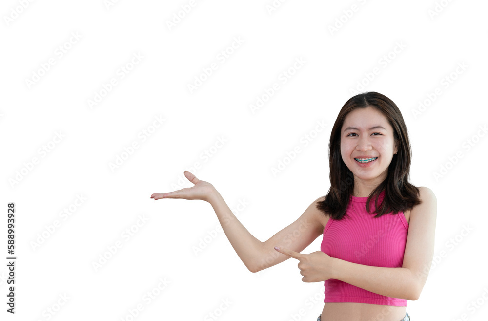 Asian woman with holding copyspace imaginary on the palm to insert an ad, Showing copyspace pointing, Showing her hand to present something on yellow background. Asian woman with holding copyspace imaginary on the palm to insert an ad, Showing copyspace pointing, Showing her hand to present something on yellow background.