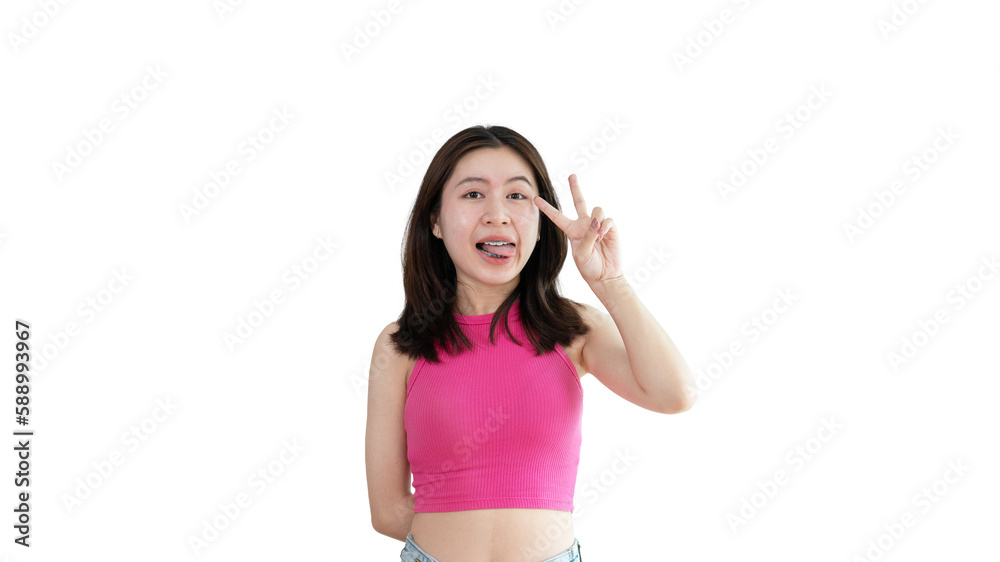 Young Asian woman making two thumbs up gesture showing joy and fun, Symbol of good friendship, Popular photo poses, Make a v-shaped finger, Yellow background. Young Asian woman making two thumbs up gesture showing joy and fun, Symbol of good friendship, Popular photo poses, Make a v-shaped finger, Yellow background.