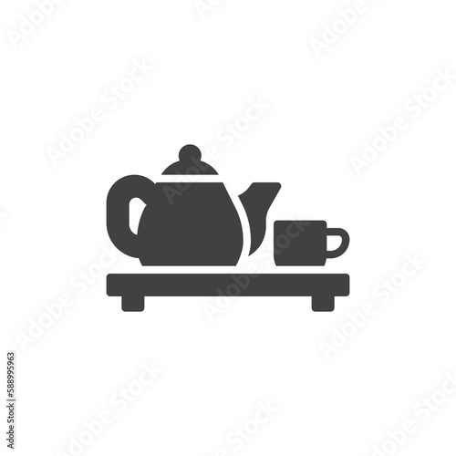 Tea pot and cup on a wood board vector icon