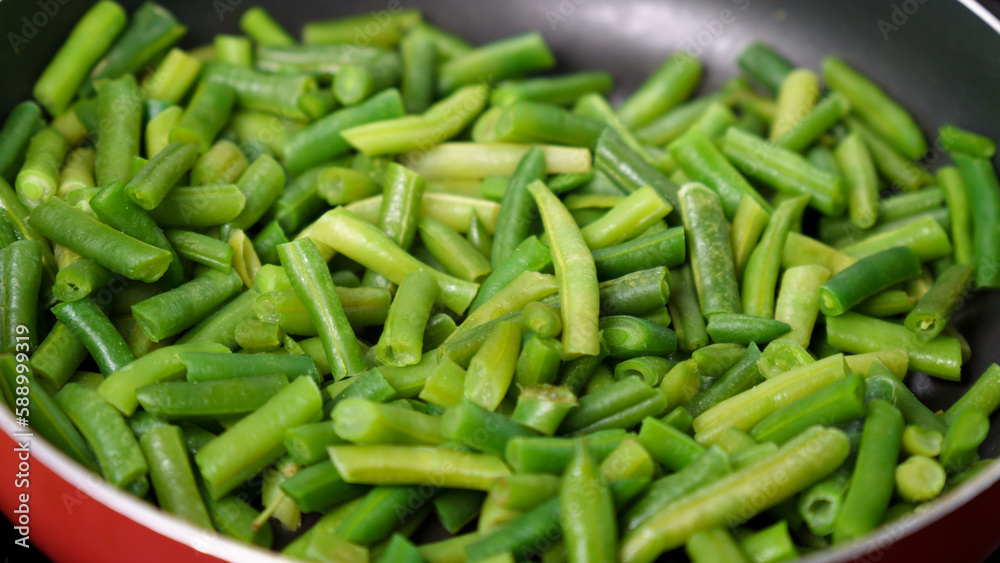 Green beans ready for cooking in frying pan. Bio green beans. Cooking concept