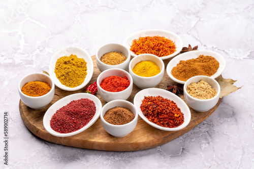 Various dried spices in small bowls