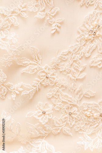 Beautiful beige background with embroidered colors and bisser. gentle pastel wedding background. wedding concept.
