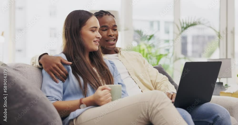 Laptop, coffee and couple talking in living room on home sofa, relax or online shopping. Computer, interracial and happiness of man and woman on couch internet browsing, social media or web scrolling Laptop, coffee and couple talking in living room on home sofa, relax or online shopping. Computer, interracial and happiness of man and woman on couch internet browsing, social media or web scrolling