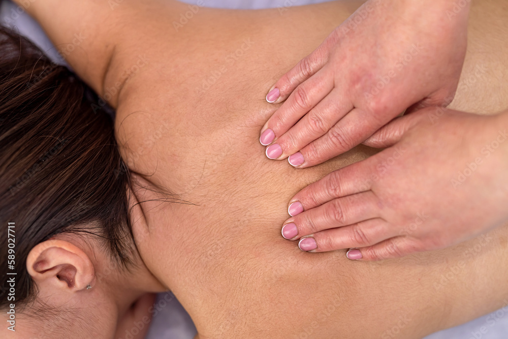 Young woman lying on table and receive relax massage on spa Young woman lying on table and receive relax massage on spa