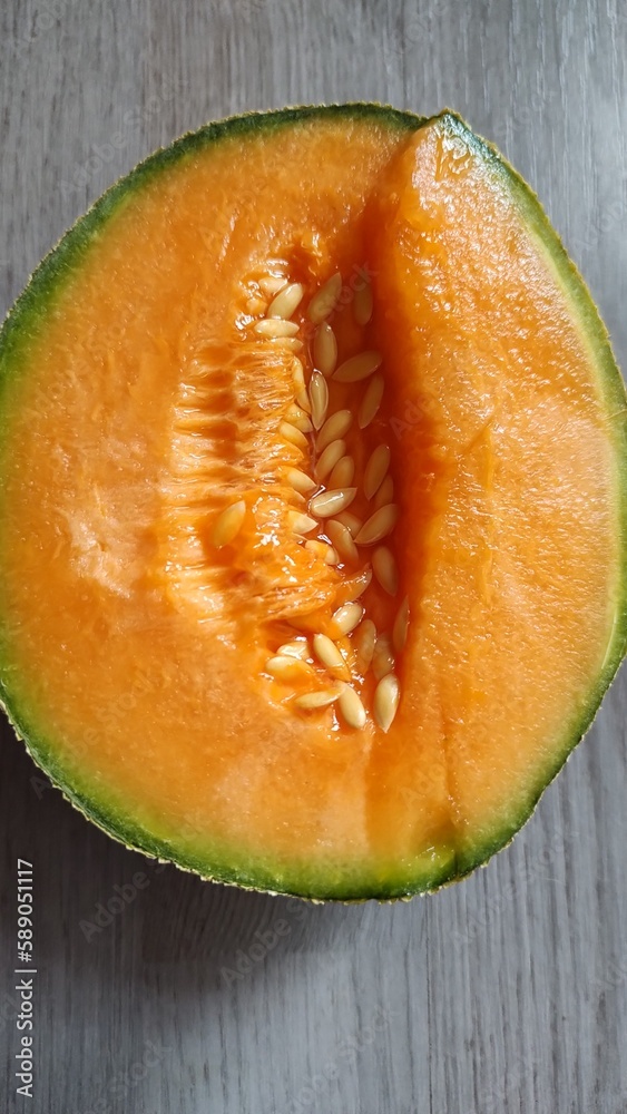 The charm of the natural: Macro photography of half a fresh and tasty melon, capturing the details like its seeds. The charm of the natural: Macro photography of half a fresh and tasty melon, capturing the details like its seeds.