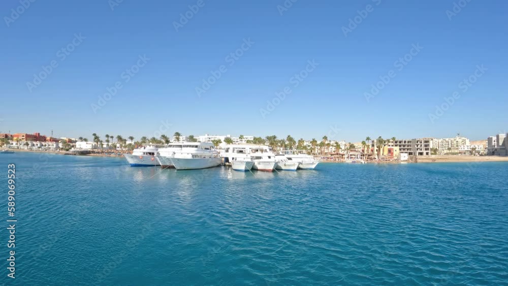 Moored luxury yachts at tropical resort, handheld view Moored luxury yachts at tropical resort, handheld view