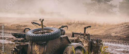 MILITARY MOTORCYCLE - An old German machine in camouflage colors photo