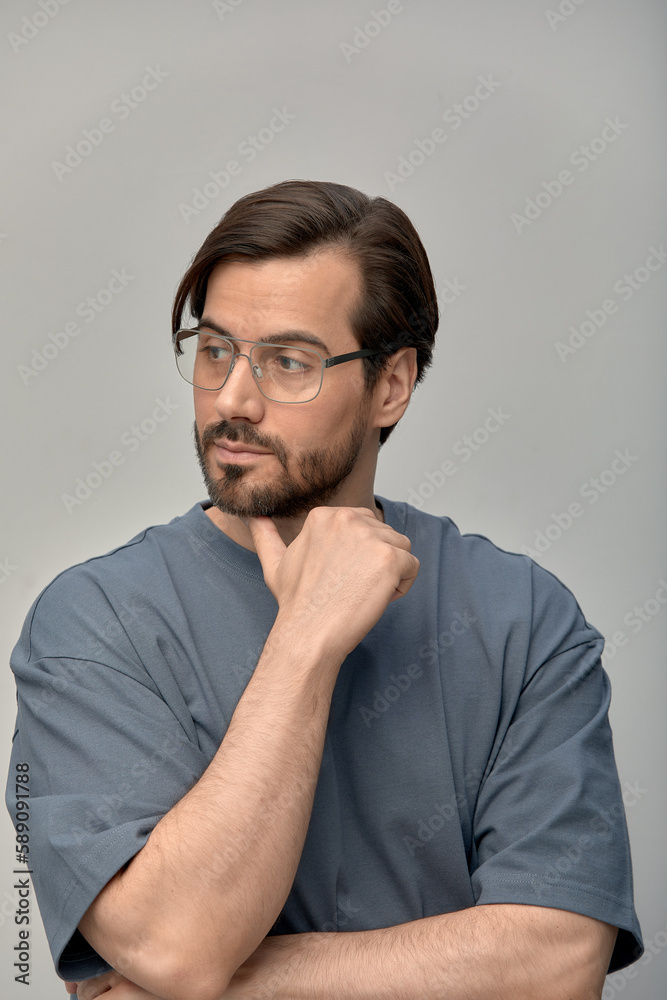 Young handsome man with beard wearing casual sweater and glasses happy face smiling with crossed arms looking at camera. A positive person.