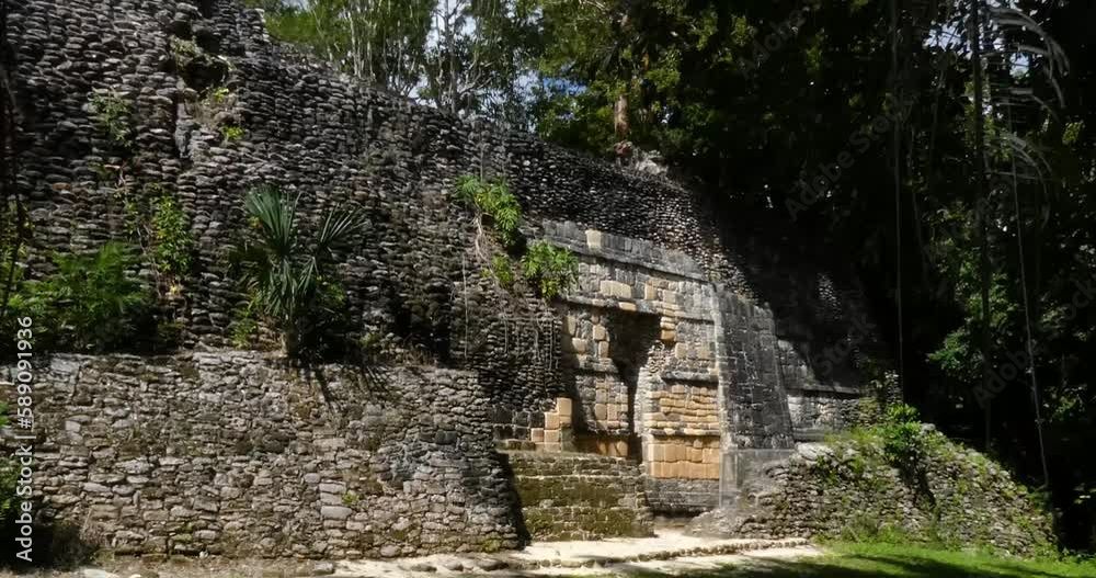 South Wall of the Acropolis seen from the Plaza of the Stelae, Kohunlich mayan site - Quintana Roo, Mexico South Wall of the Acropolis seen from the Plaza of the Stelae, Kohunlich mayan site - Quintana Roo, Mexico