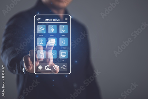 Fotografi Smart Home and new technology to management the house, House intelligent control system concept, Hand shows the signs of smart home icon on dark background, Idea of new smart solution