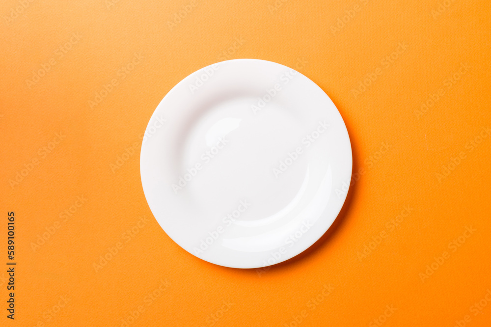 Top view of isolated of colored background empty round white plate for food. Empty dish with space for your design Top view of isolated of colored background empty round white plate for food. Empty dish with space for your design