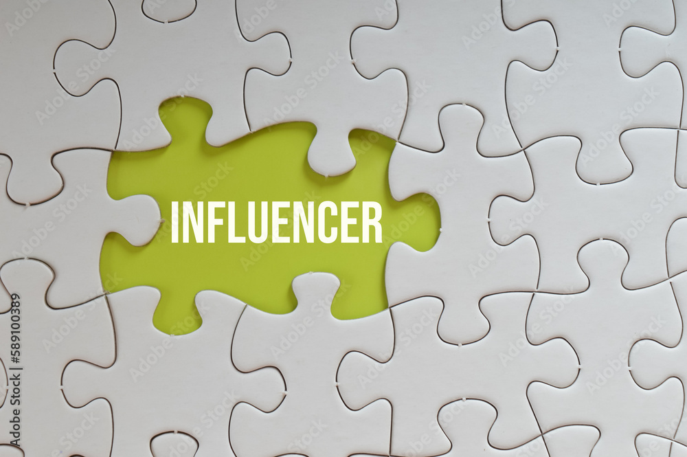 Green puzzle background written with text INFLUENCER. Green puzzle background written with text INFLUENCER.