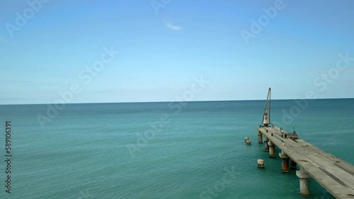 drone view of the bridge in the beautiful black sea on which there is a crane and cars. beautiful angle