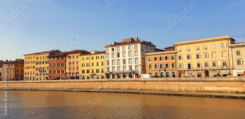Panorama of Pisa street and Arno river at sunset.