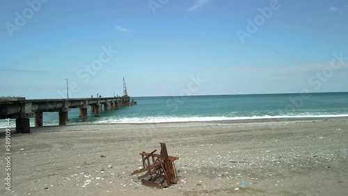 drone view of the bridge in the beautiful black sea on which there is a crane and cars. beautiful angle