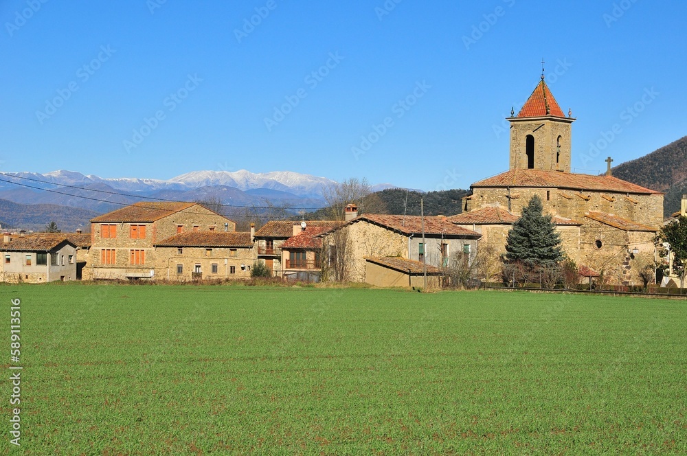 View of town buildings and the church in Els Hostalets d'en Bas, Girona, Spain.