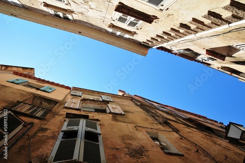 Low angle of residential buildings under a clear blue sky