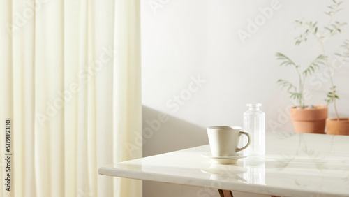A room with a calm atmosphere, with clay pots placed in front of the wall and curtains letting in natural light. Glass bottles, coffee, and various objects on a marble table.