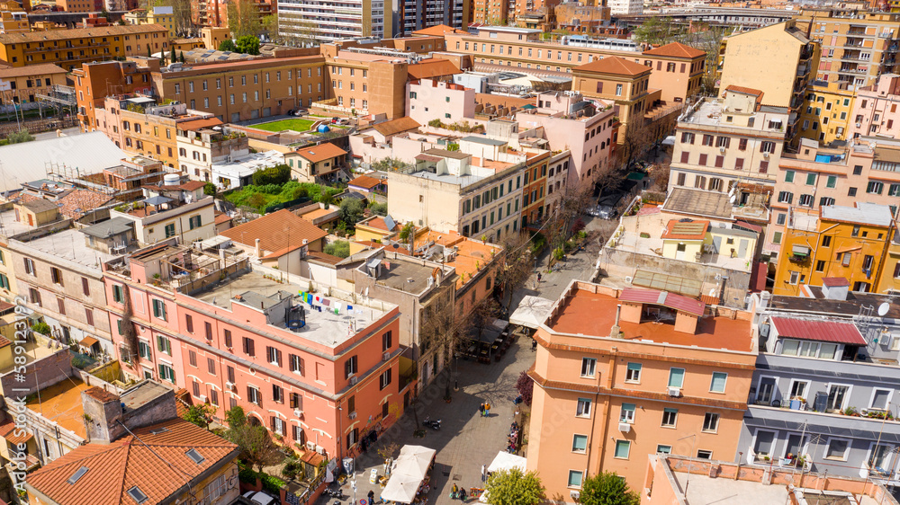 Aerial view of the main street of the Pigneto district in Rome, Italy. It is a pedestrian street in a residential area with many buildings.