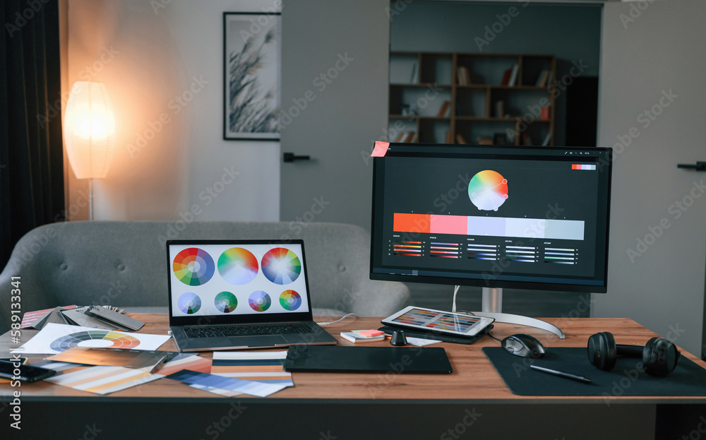 Computer, laptop, displays with designer's software. In the office