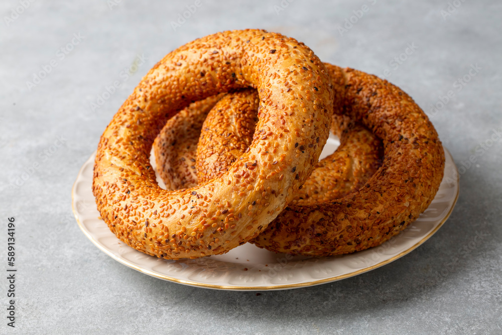 Turkish fast food bagel called Simit. Turkish bagel Simit with sesame. Bagel is traditional Turkish bakery food. Turkish fast food bagel called Simit. Turkish bagel Simit with sesame. Bagel is traditional Turkish bakery food.