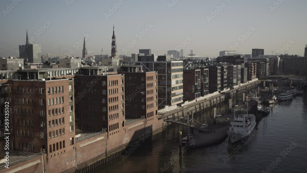 Beautiful cityscape of Hamburg with ships sailing on a tranquil river and traditional buildings Beautiful cityscape of Hamburg with ships sailing on a tranquil river and traditional buildings